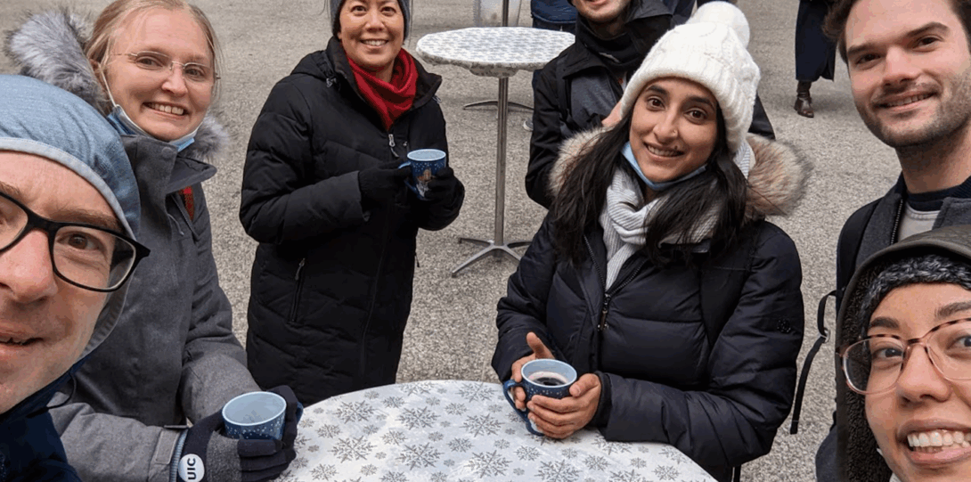 Federle Lab members drink mulled wine while taking a selfie at the Chicago Christkindlmarket